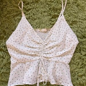 White flowery cinched loose tank top with flower detail